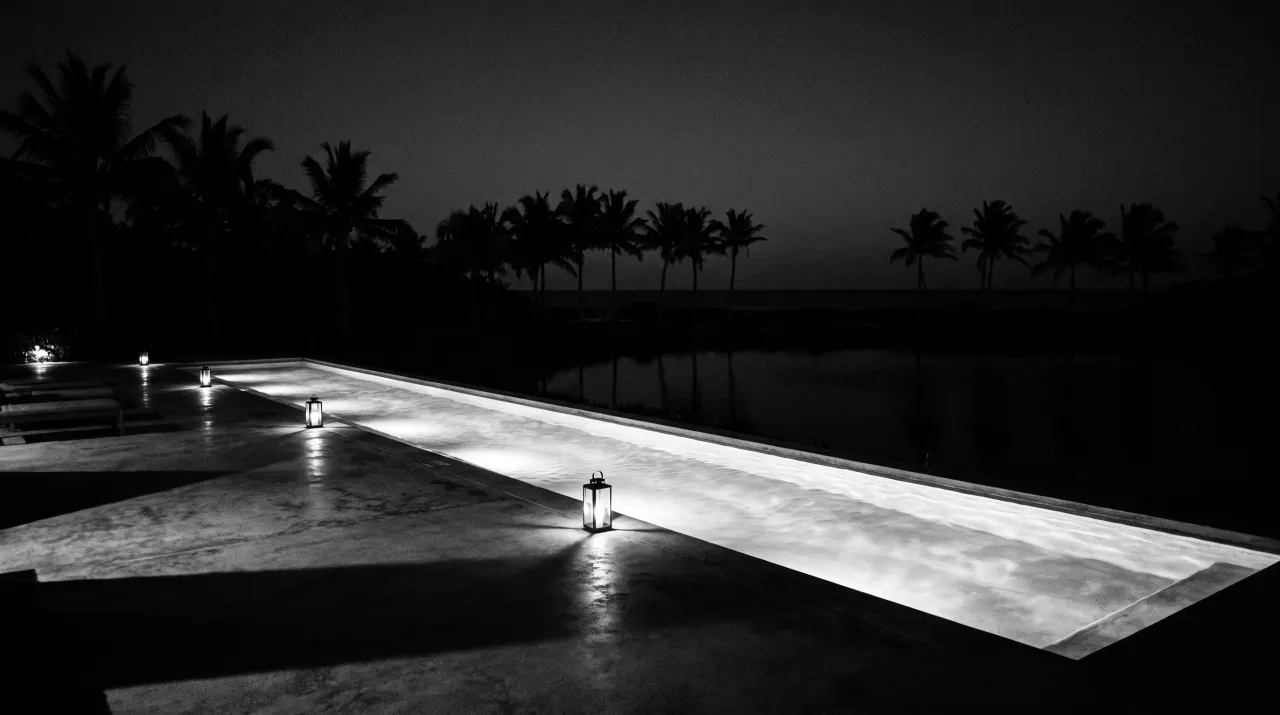 The lap pool at night, lit from below